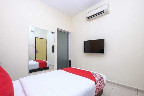 Hostal Oyo 89493 Q Hotel