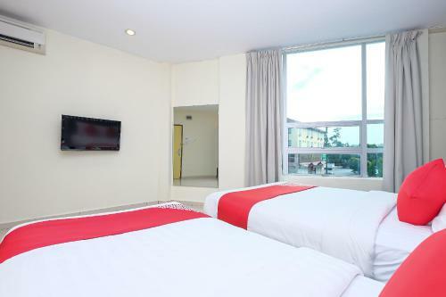 Hostal Oyo 89493 Q Hotel