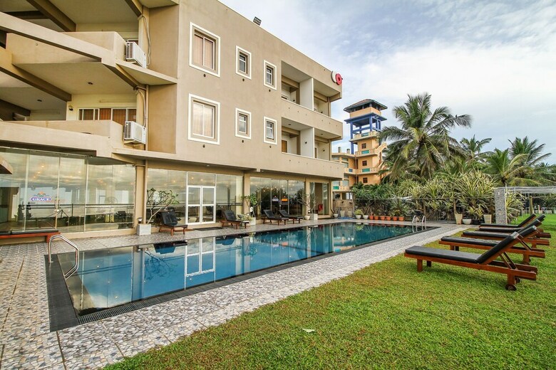 Hotel Capital O 311 Grace Beach Resort