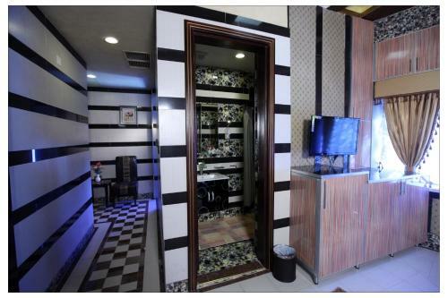 Apartamento Roomi Suites Hotel